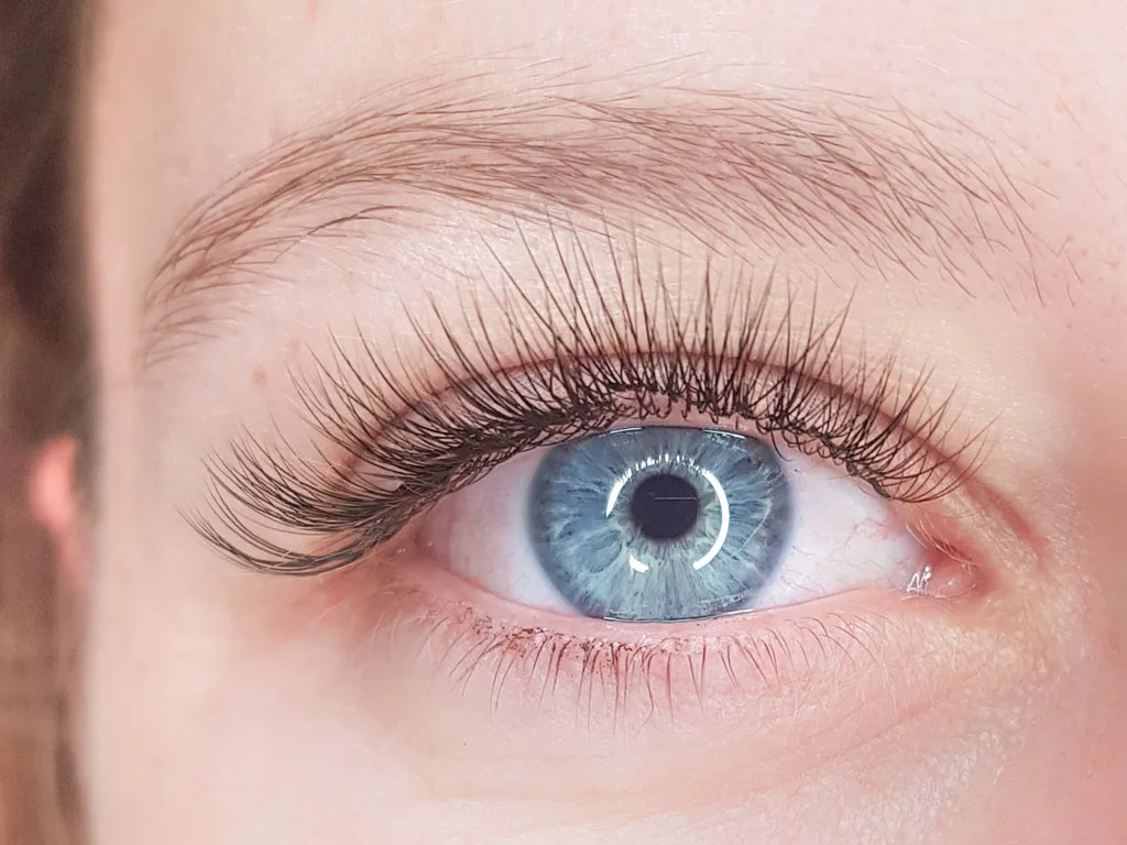 Classic eyelash extensions at Sugaring NYC McKinney — open, lifted eye appearance