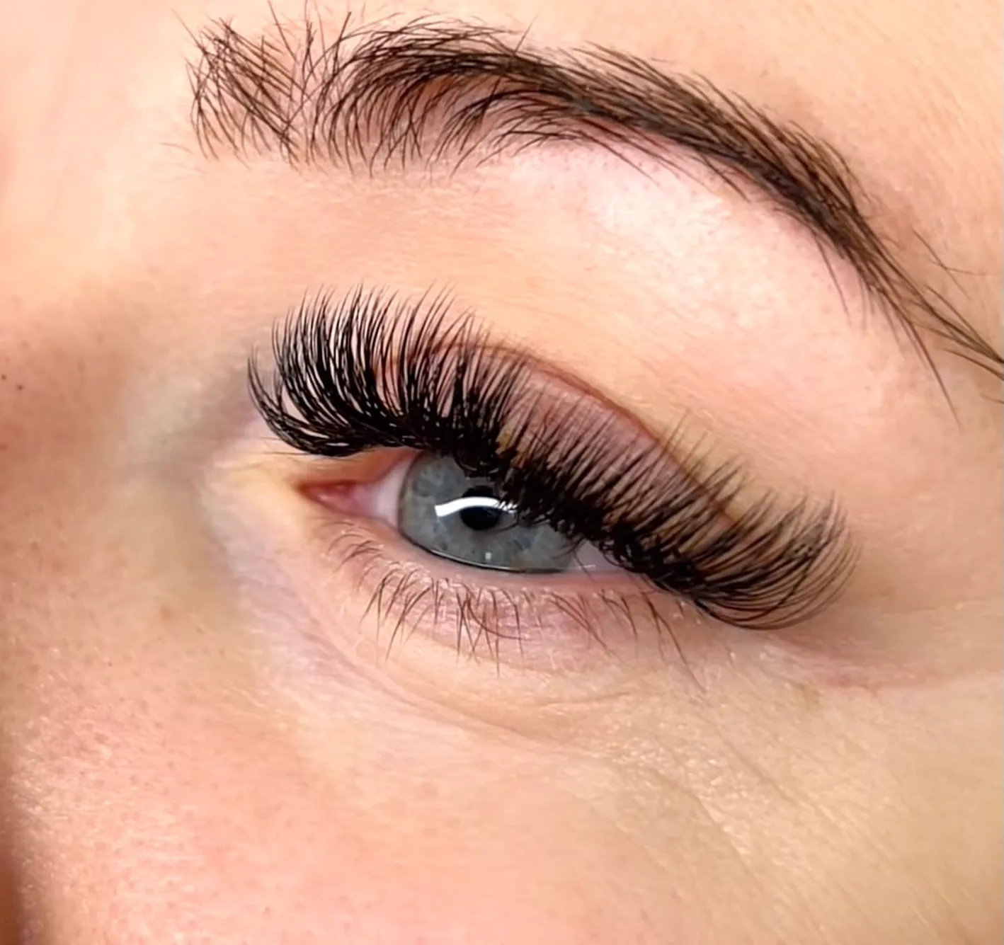 Classic lash extensions at Sugaring NYC McKinney — subtle cat-eye effect