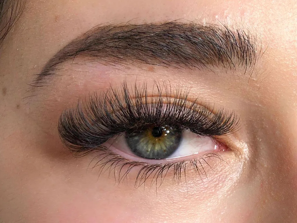 Volume eyelash extensions at Sugaring NYC McKinney — glamorous full lash result