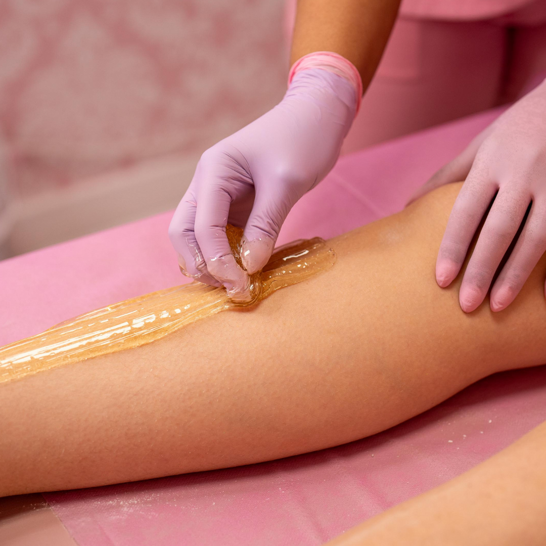 All-natural body sugaring hair removal service at Sugaring NYC McKinney — sugar paste applied to skin